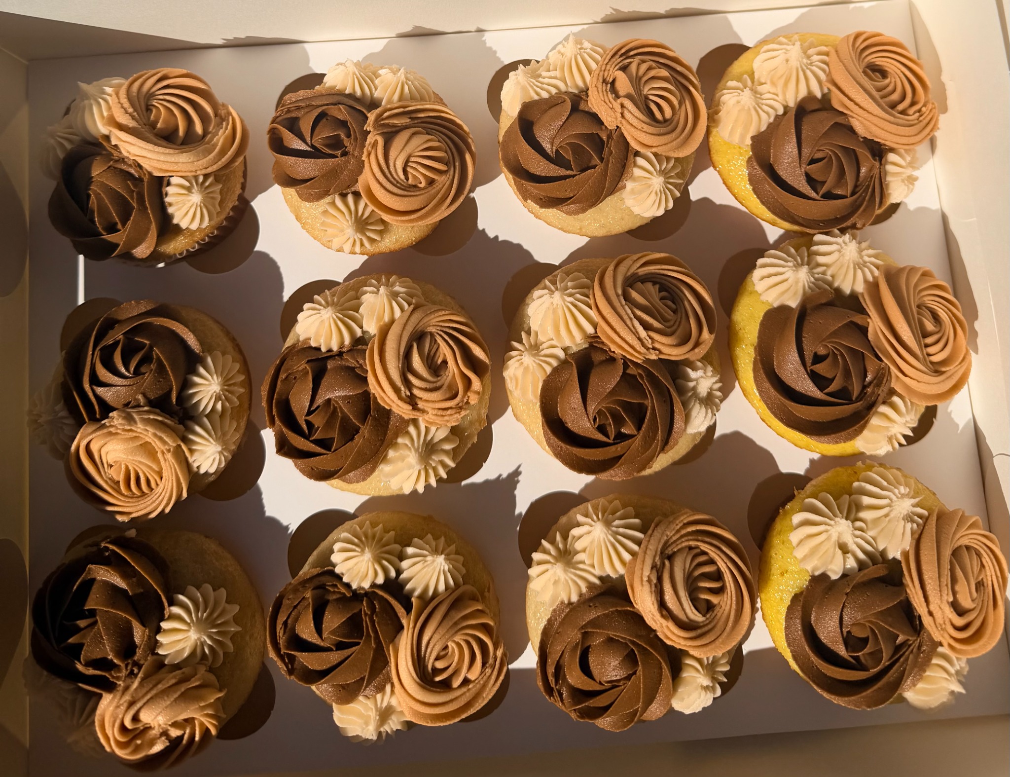 Cupcakes with detailed piped rosettes